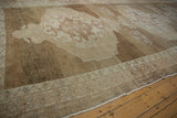 Detail of vintage distressed Oushak carpet, highlighting abrashed field and patterned border.