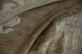 Distressed pile texture of a vintage Oushak carpet with beige and coffee brown tones.