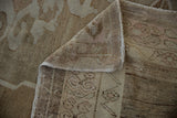 Abrashed texture of the Vintage Distressed Oushak carpet with beige, sand, and blush.