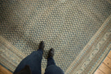 Distressed vintage Mir Sarouk field showing faded blue and beige allover pattern.