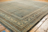 Distressed vintage Mir Sarouk border, with visible wear, muted blue and beige patterned detail.