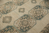 Repeating geometric floral guls and stepped medallions on distressed vintage Ersari rug.