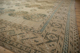 Softened geometric border patterns and guls in ivory, pale blue, and coffee brown.