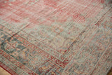 Distressed Oushak carpet detail, highlighting low pile texture, pale red, and oxidized silver tones.