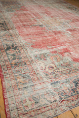 Distressed vintage Oushak pile showing pale red, oxidized silver, and visible foundation.