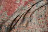 Textured pile of vintage distressed Oushak rug, revealing pale red and muted silver.