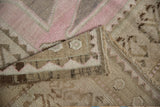 Vintage Distressed Oushak rug texture with soft pink, beige, and brown abrash.