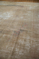 Worn pile of vintage distressed Kashan carpet, revealing foundation and subtle raspberry tones.