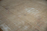 Distressed Kashan rug with worn texture, visible foundation, and subtle faded patterns.