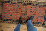 Uzbeki Khotan runner, tomato red geometric tree of life motif with navy accents.