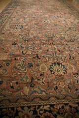 Vintage Mahal carpet's navy outer border and geometric band with brick red field.