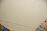 Ivory hand woven Turkish Flatweave rug with varying hand-spun texture and finished edge.