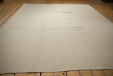 Lightweight ivory Turkish flatweave rug, showing its fine handwoven texture.