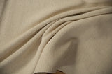 Ivory hand-woven Turkish flatweave texture, showing varying thickness.