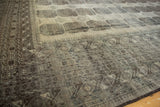 Distressed vintage Ersari carpet with intricate geometric border patterns.