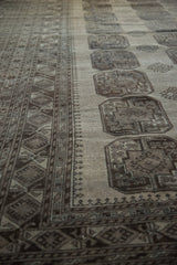 Distressed Ersari carpet, showcasing geometric borders and elephant's footprint gul motifs.