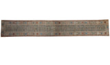 Antique Malayer rug runner with intricate field motifs and a geometric rainbow border.