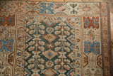 Antique Malayer runner detail: geometric plant pattern, diamond shapes, borders, in teal, terracotta, beige.