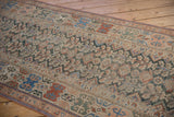 Antique Malayer runner's unusual geometric banded main border in terracotta, sky blue, and beige.