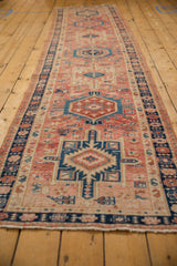 Distressed Karaja runner with geometric medallion, boteh border, worn blush, navy, copper tones.