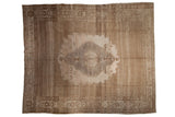 Distressed Oushak carpet, large scalloped medallion, time-softened sand and silver tones, 9'4