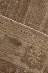 Vintage distressed Oushak rug showing short pile, hand-knotted foundation, and intact selvage.