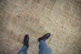 Distressed Sivas carpet texture with worn knot heads, ivory, dusty rose, and navy floral field.