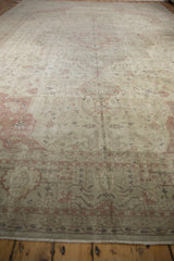 Faded dusty rose floral patterns on the distressed Sivas carpet border and field, showing visible even wear.