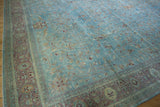 Distressed Meshed carpet corner, intricate blush, sand, and pale red floral border.
