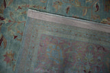 Distressed vintage Meshed carpet pile, faded blue-red, revealing woven foundation and selvage.