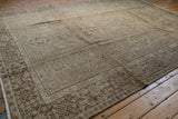 Distressed hand-knotted Karaja carpet corner, ivory fringe, oxidized silver border details.