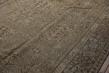Distressed vintage Karaja carpet border and field, geometric motifs in charcoal and ivory.