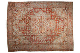 Distressed Heriz carpet with large medallion, geometric floral design in deep red, ivory, powder blue.