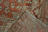 Distressed vintage Heriz carpet pile showing wear with faint foundation through knot heads.
