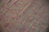 Detail of distressed vintage Kerman carpet with pale raspberry blush, dusty blue millefleur. Even wear, faint foundation.