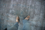 Vintage distressed Turkish Sparta rug's textured pile in muted silver and dusty cobalt blue.