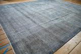 Vintage Sparta carpet's distressed pile shows oxidized silver and dusty cobalt blue hues.
