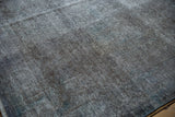 Distressed Sparta carpet texture, showing mostly even wear, oxidized silver, and dusty cobalt blue hints.
