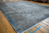 Distressed texture and varied pile of a vintage Sparta rug with dusty cobalt blue and oxidized silver.