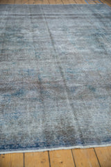 Textured, low pile surface of the distressed Sparta carpet with silver and dusty cobalt tones.