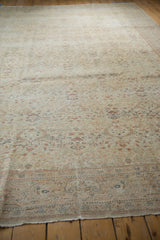 Distressed vintage Kayseri carpet with worn pile, floral field, and boteh palmette border.
