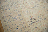 Distressed vintage Kayseri carpet texture, showing worn pile, faded ivory, blush, and blue motifs.