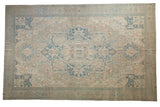 Distressed Vintage Oushak rug with oversize quatrefoil medallion, floral palmettes, beige, sky blue tones.
