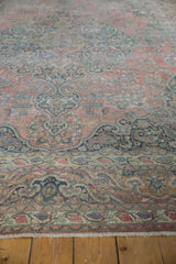 Distressed vintage Khorossan carpet: faded coral Islimi arabesques, blue Safavid border, fringe.