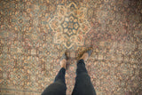 Distressed vintage Hamadan carpet, geometric Herati design in dusty apricot and denim blue, showing wear.