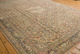 Distressed vintage Hamadan carpet with geometric Herati motif in dusty apricot and denim blue.