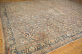 Distressed Hamadan carpet with geometric Herati design, dusty blue border, apricot, and even wear.