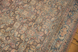 Vintage Distressed Hamadan carpet detail: geometric Herati field, faded denim blue, dusty apricot, worn texture.