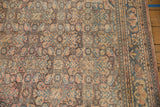 Distressed geometric Herati pattern in dusty apricot, denim blue, and sand on a vintage Hamadan rug.