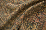 Distressed Hamadan rug's Hosseinabad Herati pattern in dusty apricot, blue, and faint foundation.